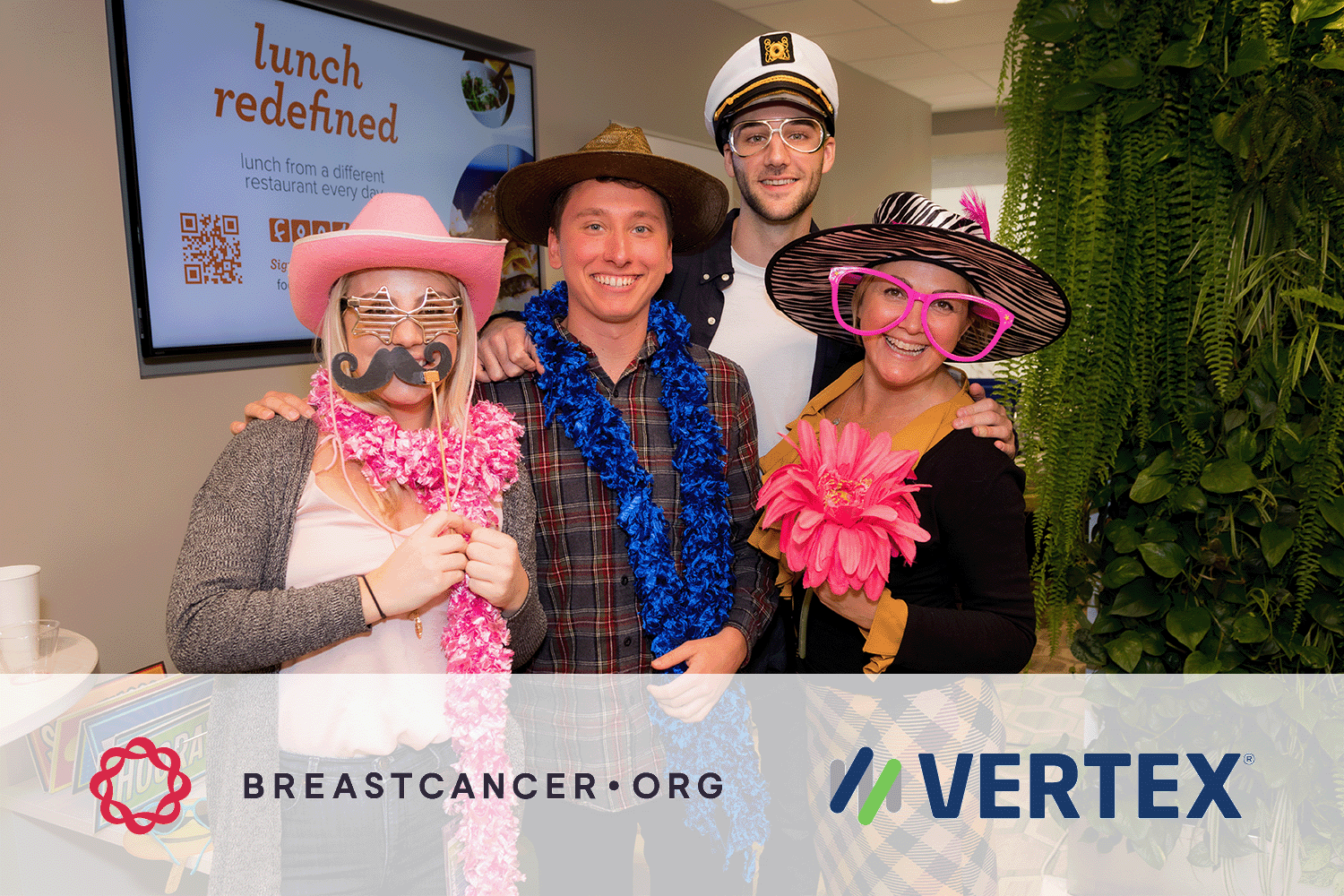 Four Vertex employees at a Halloween fundraising event