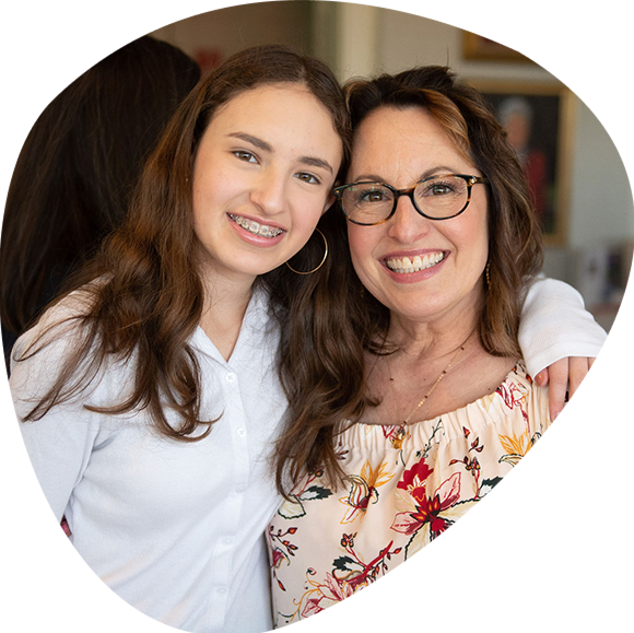 A woman and her daughter smiling at A Day in the Garden