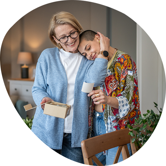 A woman and her mother looking at photographs