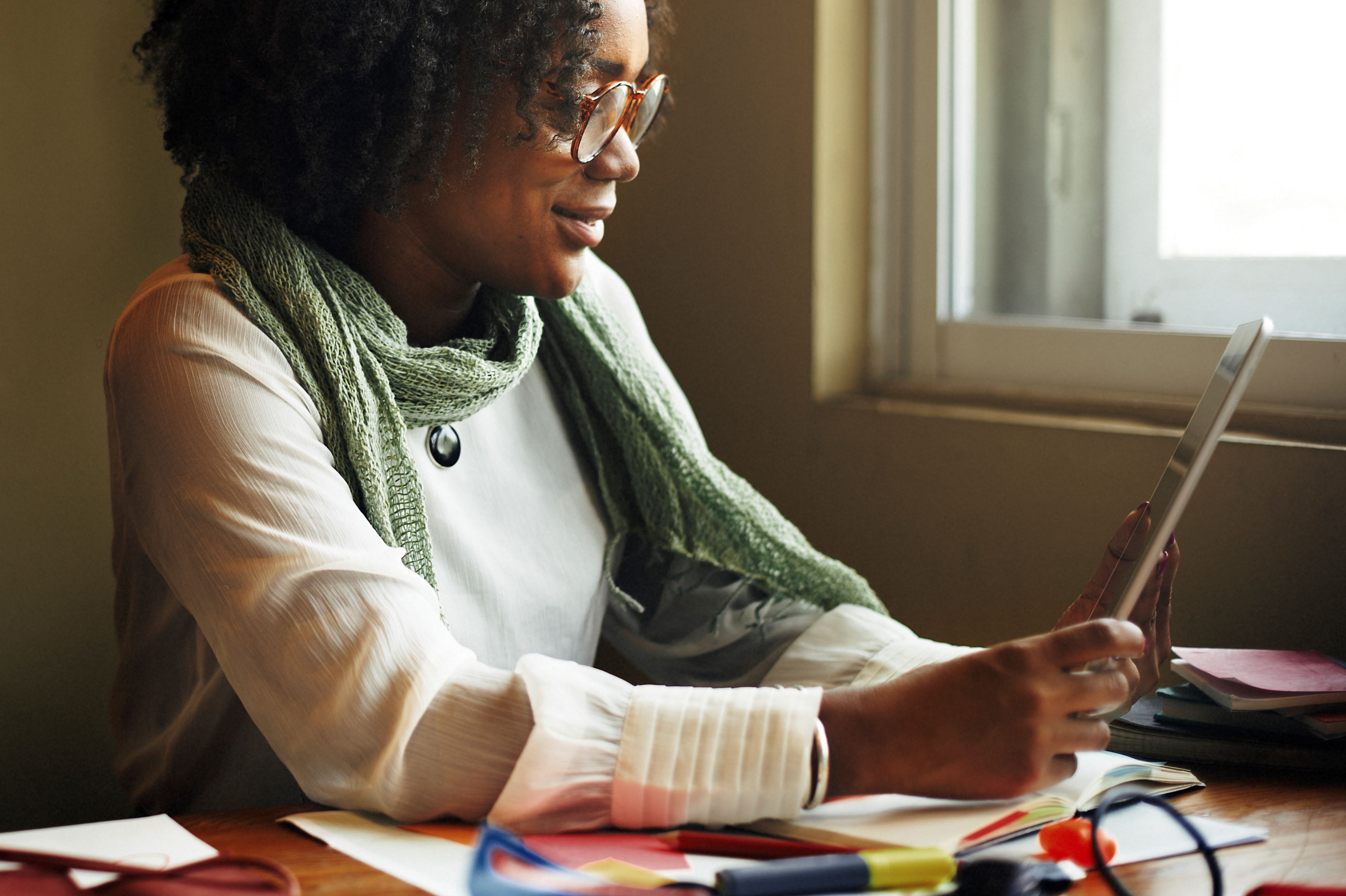 A woman looking at a tablet