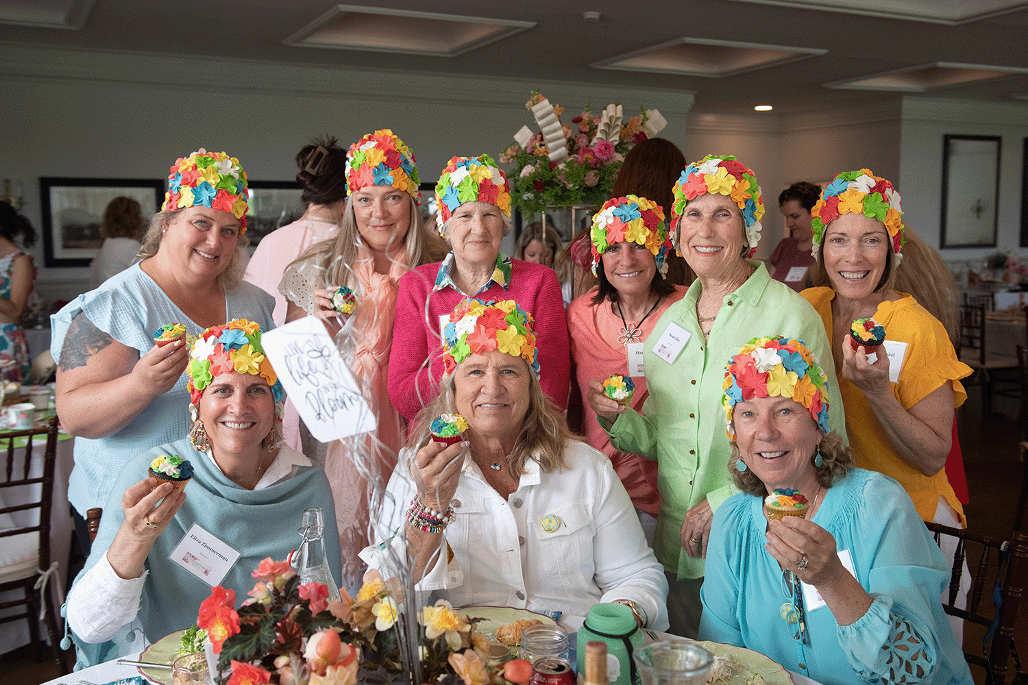 A group of guests showing off their tablescape 